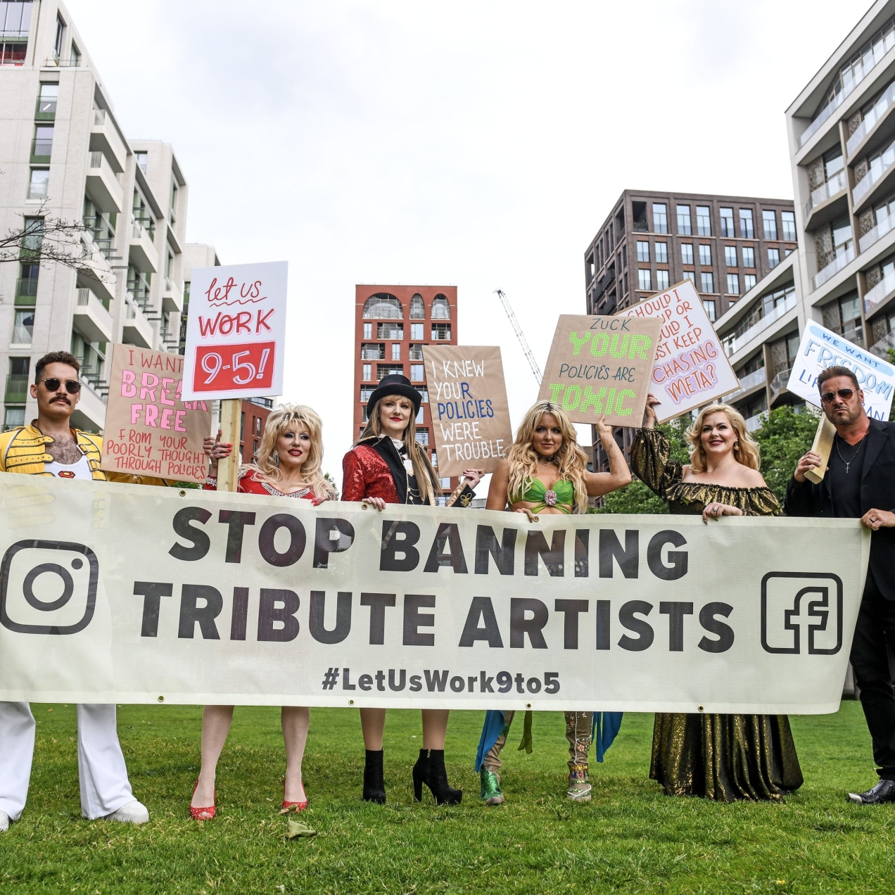 Five impersonators holding placards and a banner stood outside Meta's offices. The acts are impersonators of Freddie Mercury, Dolly Parton, Taylor Swift, Britney Spears, Adele and George Michael